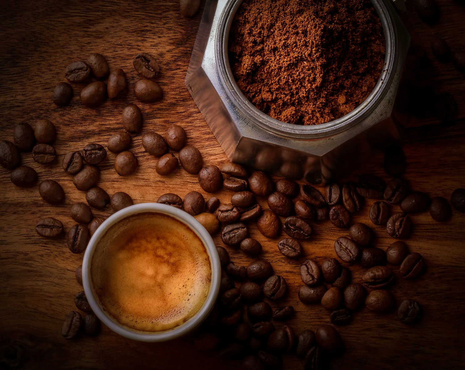 Photo by 🇸🇮 Janko Ferlič brown coffee beans beside white ceramic mug